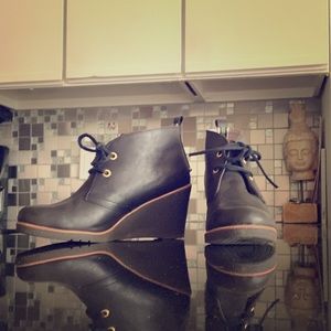 Black leather Sperry wedge booties